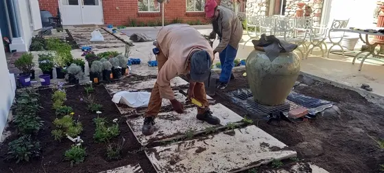 Crew planting a courtyard bed